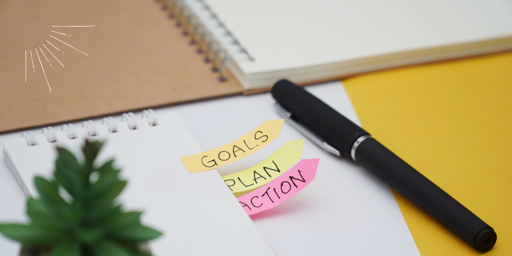 Notizzettel mit den Worten: Goals Plan Action, Selbstsabotage überwinden